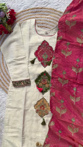 Elegant White Embroidered Unstitched Dress Set with Intricate Floral and Tassel Detailing, Complemented by a Rich Pink Dupatta with Gold Print - Ideal for Festive Occasions