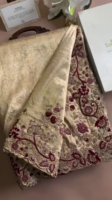 Elegant Maroon and Gold Embroidered Blouse with Intricate Floral Work, Paired with a Beige Embellished Skirt – Perfect for Festive Occasions