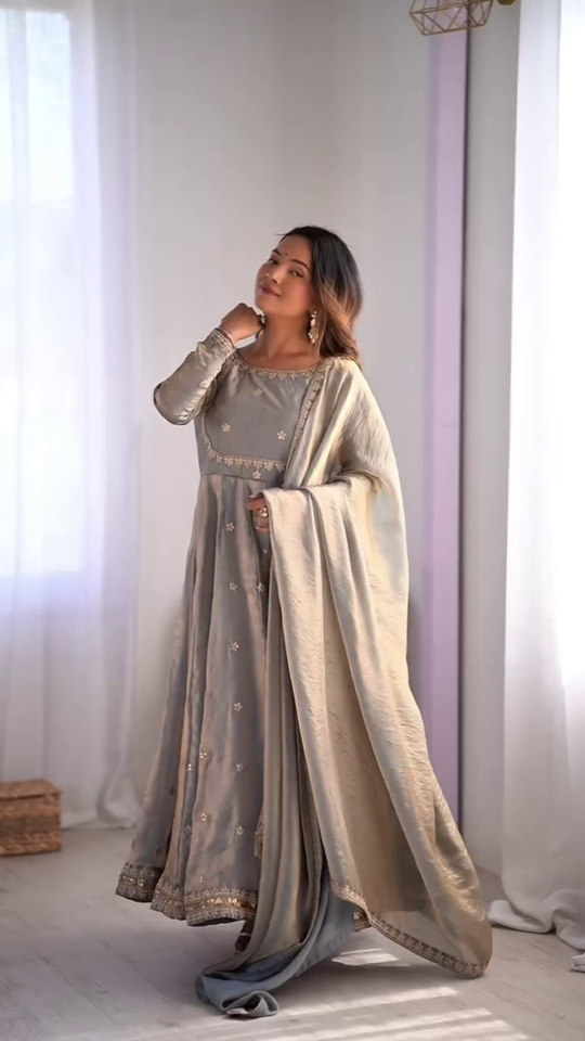 Graceful Light Blue Embroidered Anarkali Dress with Delicate Floral Motifs and Golden Borders, Paired with a Matching Dupatta