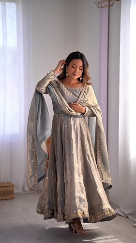 Graceful Light Blue Embroidered Anarkali Dress with Delicate Floral Motifs and Golden Borders, Paired with a Matching Dupatta