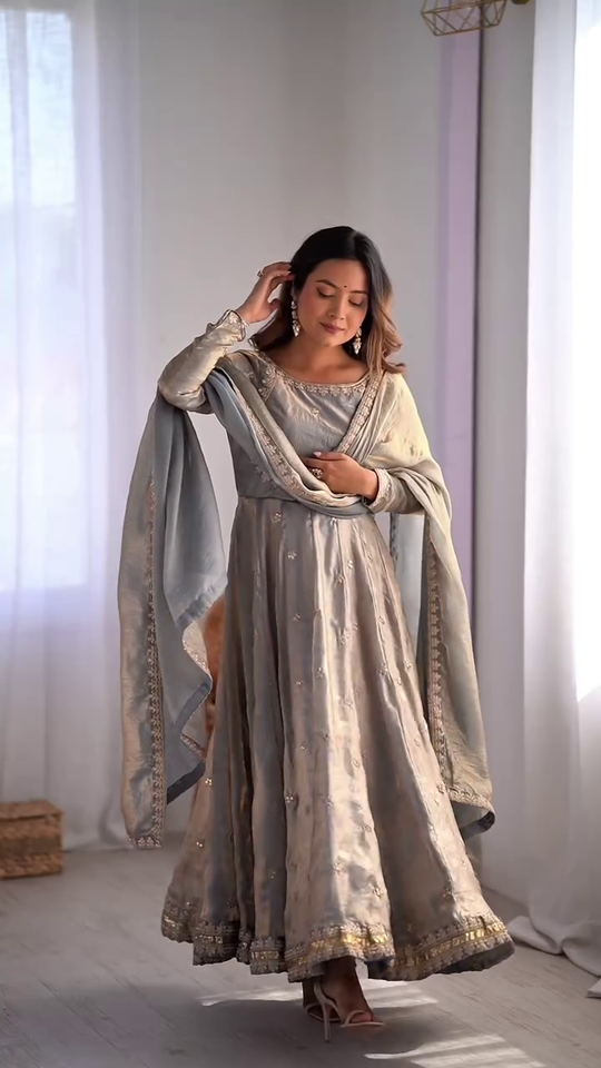 Graceful Light Blue Embroidered Anarkali Dress with Delicate Floral Motifs and Golden Borders, Paired with a Matching Dupatta