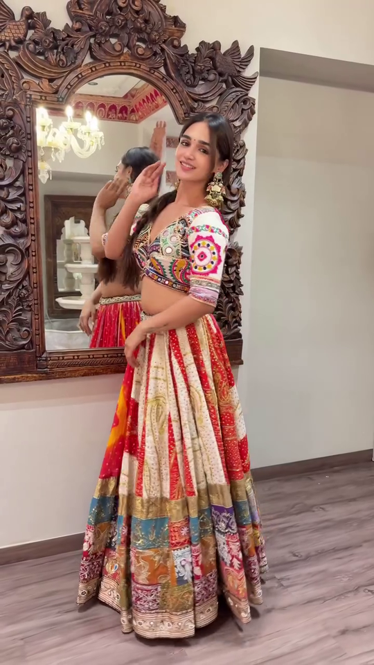 Multicolor Mirror and Thread Work Traditional Navratri Lehenga Choli Set with Heavy Flared Skirt, Embroidered Blouse, and Vibrant Bandhani Dupatta