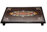 puja mane (seater). It has coloured wooden pieces inlaid in it.